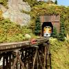 Western Pacific F3A #803 exiting Eagle Mountain Tunnel 3 approaching Edna River Gorge Tressel